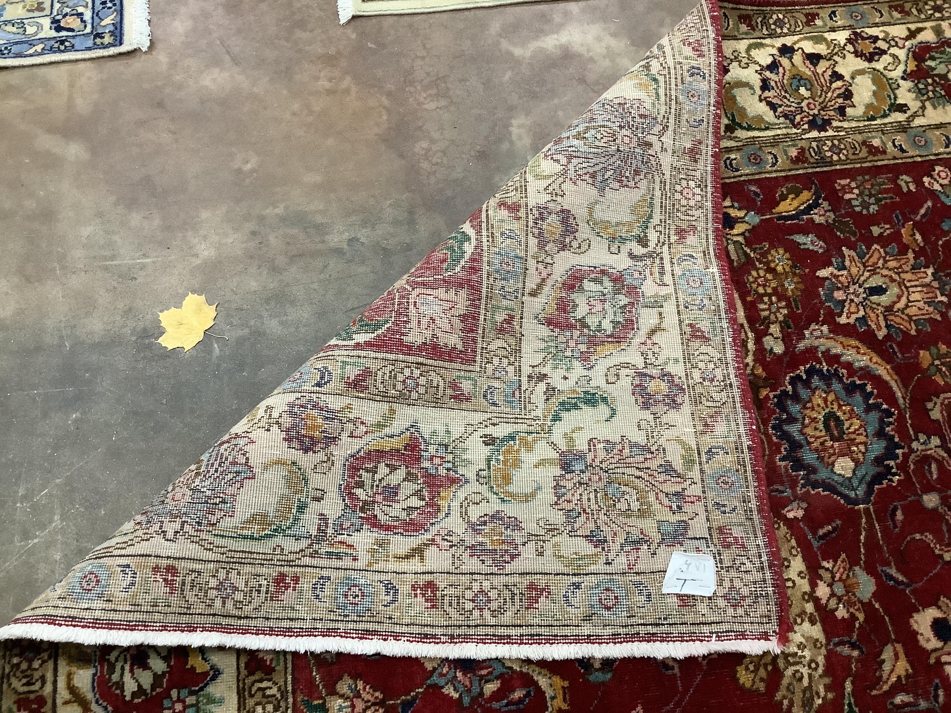 A Tabriz mid ground carpet, 320 x 220cm